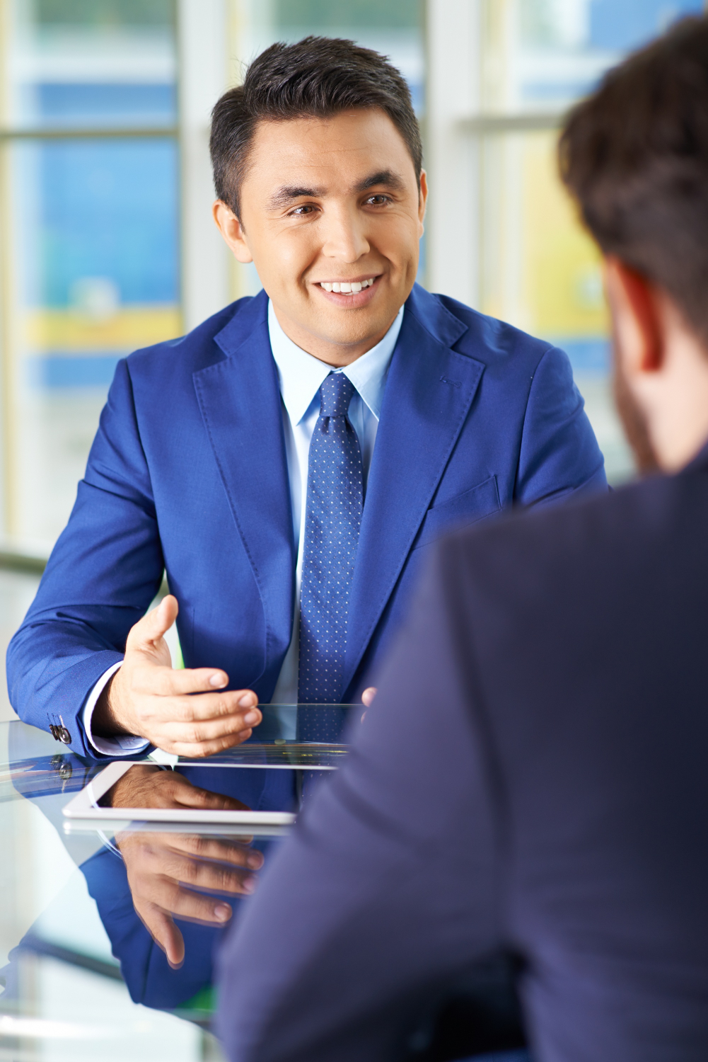 businessmen-using-touchpad-meeting